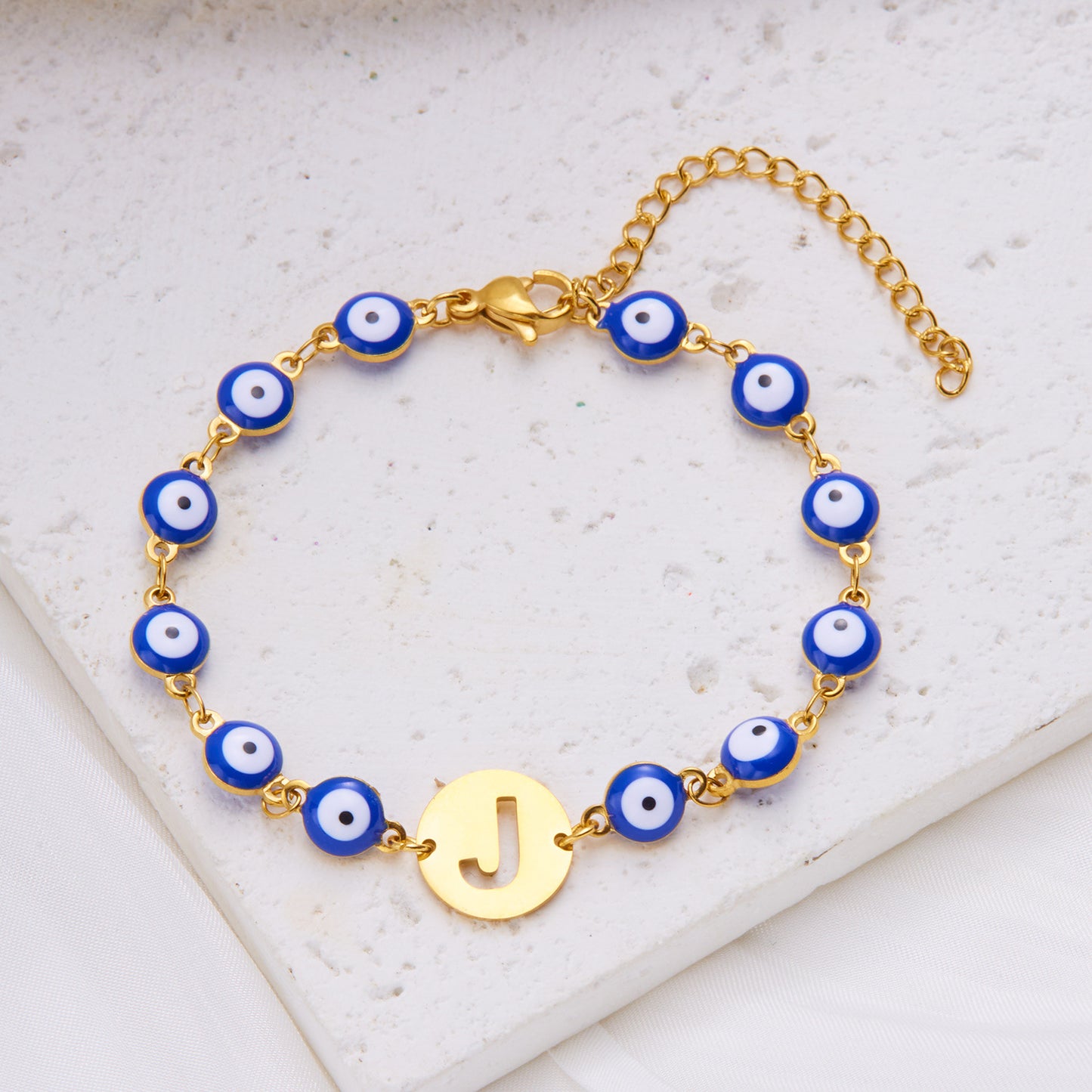 Women's High-grade Stainless Steel Blue Eyes Fashion Hollowed-out 26 Letter Bracelet