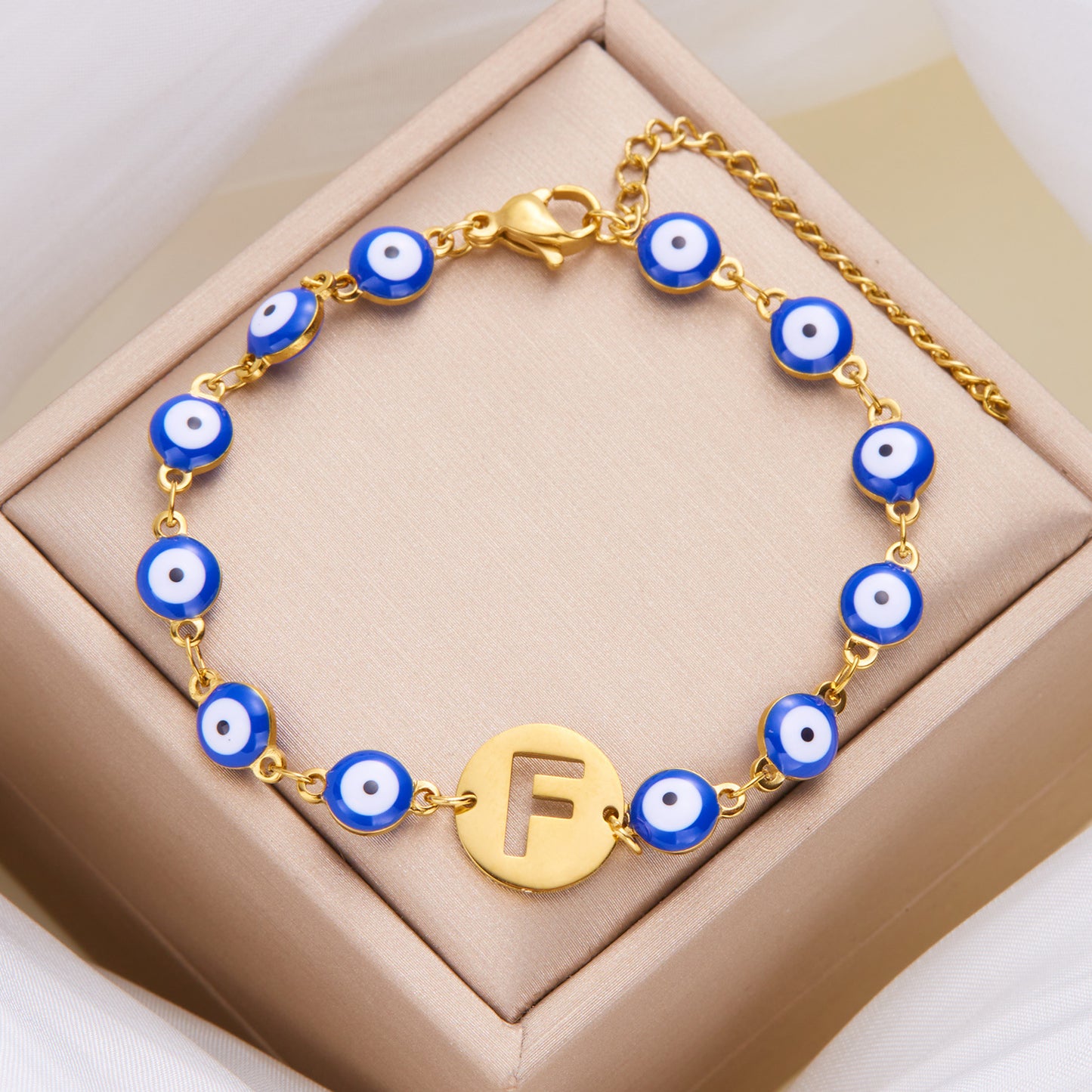 Women's High-grade Stainless Steel Blue Eyes Fashion Hollowed-out 26 Letter Bracelet