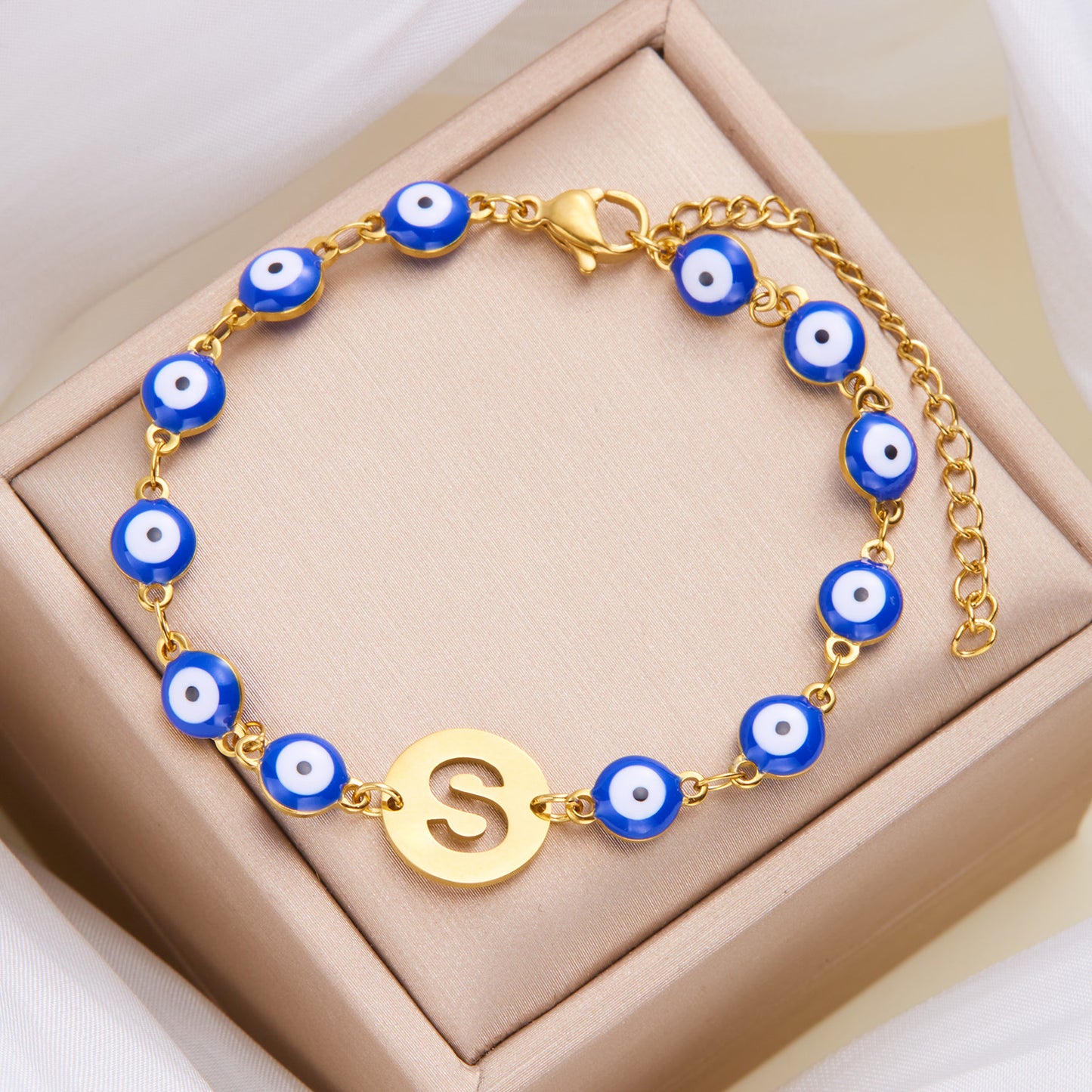 Women's High-grade Stainless Steel Blue Eyes Fashion Hollowed-out 26 Letter Bracelet