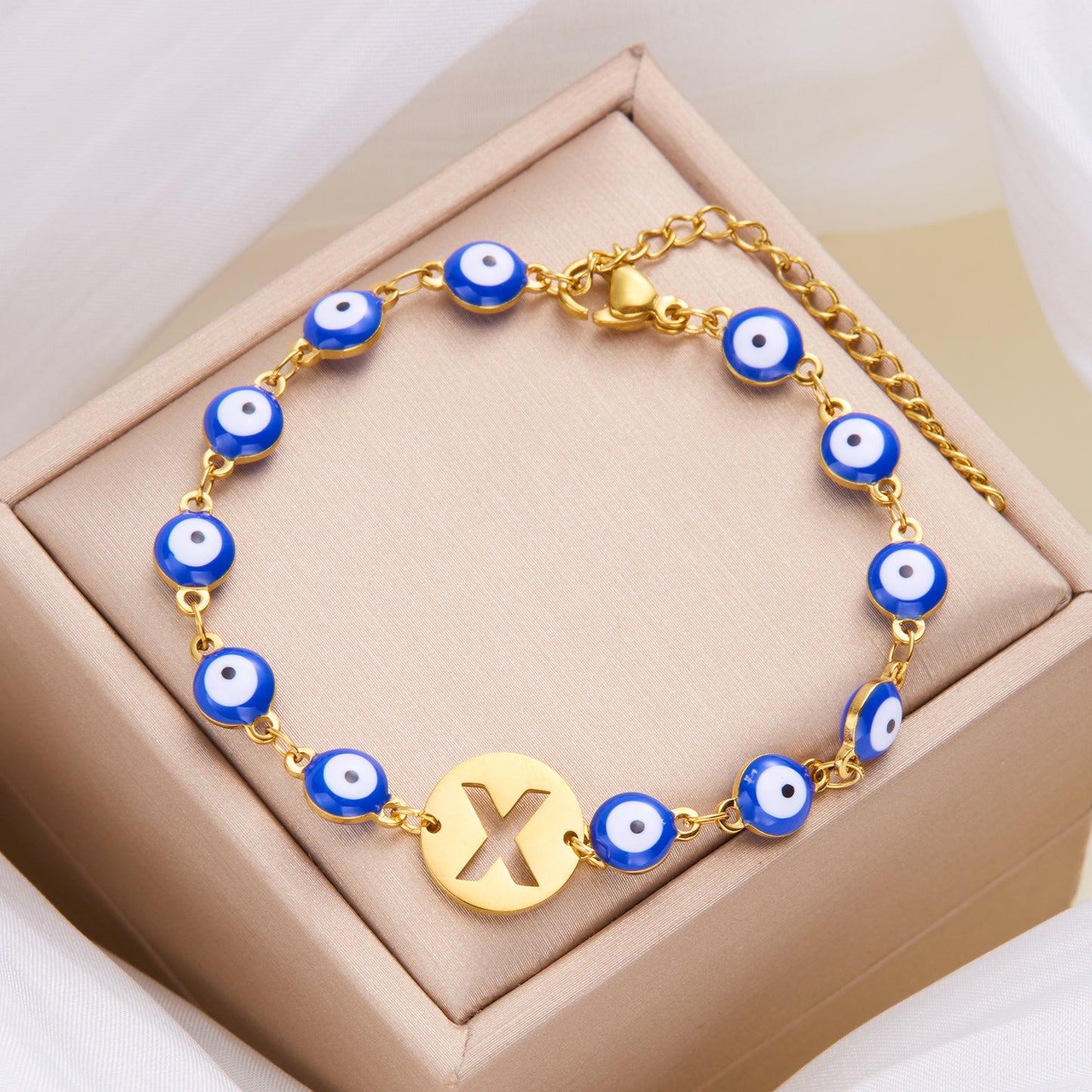 Women's High-grade Stainless Steel Blue Eyes Fashion Hollowed-out 26 Letter Bracelet